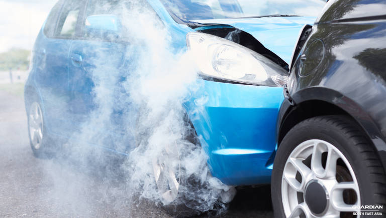 damaged car emits smoke