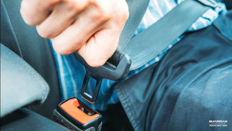 man fastening the seatbelt