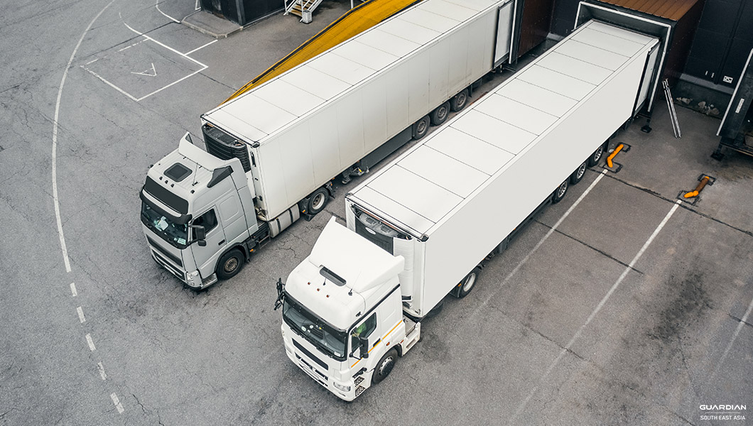 2 white trucks