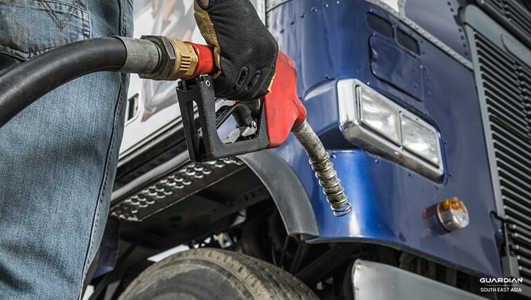 man holding gasoline pump