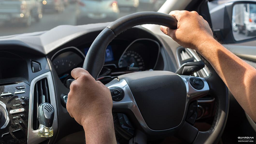 hands on the steering wheel