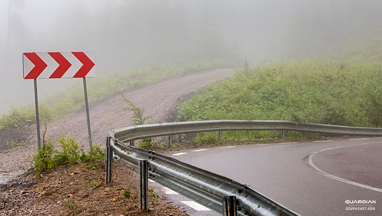 road with chevron road sign